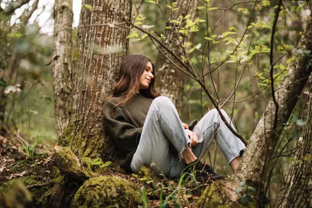 young woman sitting nature
